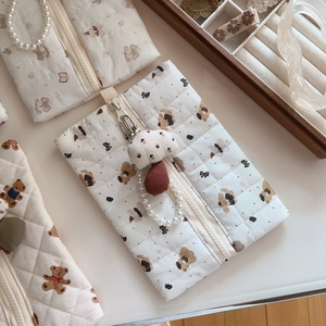 Quilted off-white cotton handbag with cute brown bear prints and decorative pendants
