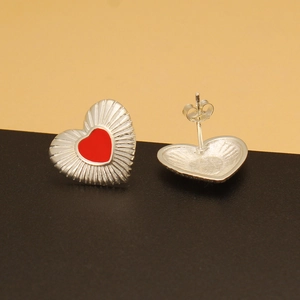 Detail view of 925 silver heart stud earrings with red enamel and textured edges