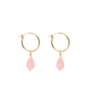 Pink teardrop crystal earrings with gold circles and pearls on a white background