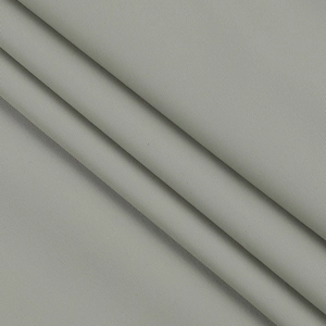 Close-up of the greyish green twill fabric texture for the off-shoulder dress details