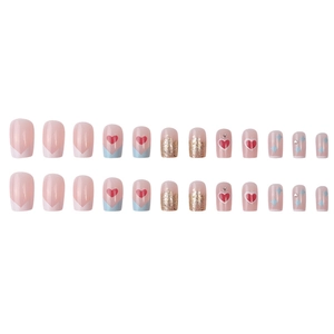 Pink French manicure press-on nails set with heart patterns and rhinestone accents