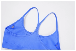 Detail of royal blue yoga bra showing Y-shaped back straps and elastic knitted fabric
