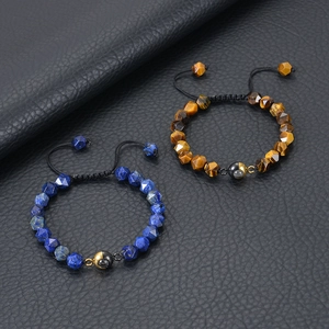 Detail of faceted tiger eye and lapis lazuli beaded bracelets with projection stones