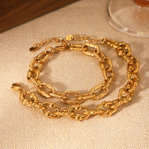 Detailed macro shot of vintage 18K gold plated thick link chains with textured surfaces