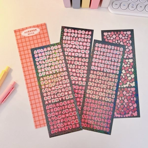 Close-up of holographic glitter alphabet and number stickers for Korean deco photocards