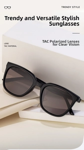 Detail view of square black sunglasses with TAC polarized lenses and a leather case