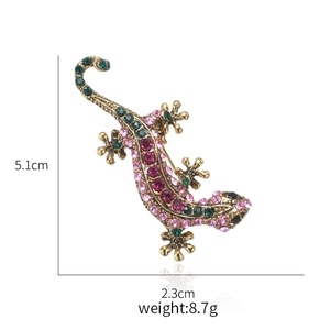 Lizard brooch detail showing size 5.1x2.3cm and rhinestones on a vintage gold base