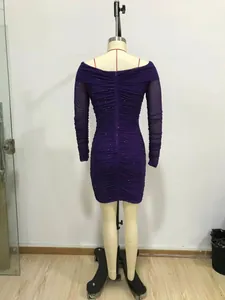 Back view of a purple sequined ruched mini dress with off-the-shoulder long sleeves