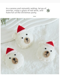Detailed view of three white wool felt polar bear Christmas ornaments with red mini hats