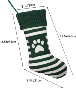 Green and white striped knitted Christmas stocking with paw print pocket and size dimensions