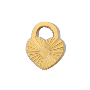 Macro shot of gold heart pendant with sunburst engraving on polished stainless steel