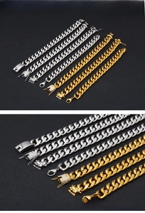 Detailansicht von goldenen und silbernen Panzerarmbändern mit Zirkonia-Verschluss