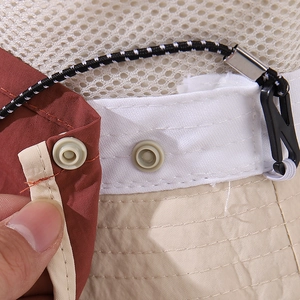 Detail of breathable mesh and adjustable snap button on children's bear sun hat