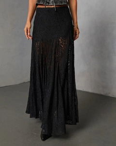 Close-up of black lace fabric pattern and textured material on the midi skirt