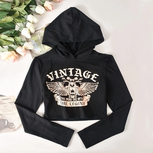 Close-up of black cropped hoodie featuring vintage rose gold motorcycle graphic print