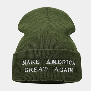 Detail of army green beanie featuring high-quality white embroidered MAGA lettering