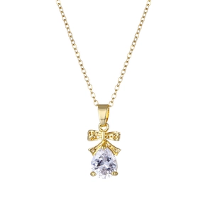 Elegant gold-tone bow necklace featuring a sparkling pear-shaped cubic zirconia pendant