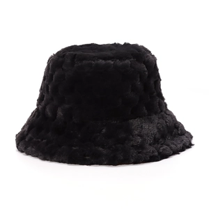 Close-up of fluffy black faux fur fabric texture on a thick winter bucket hat