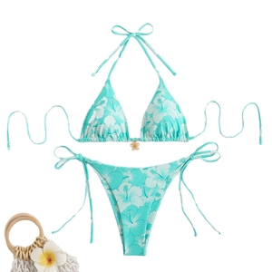 Blue hibiscus print bikini set with golden pendant and side-tie bottom for beach vacations