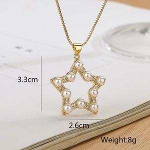 Detail shot of a star-shaped pendant with pearls and zircons, size 3.3cm by 2.6cm