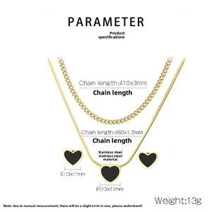 Detailed view of gold stainless steel necklace and earring set with black heart shell charms