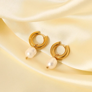 Detailed shot of 18K gold stainless steel hoop earrings with natural freshwater pearls