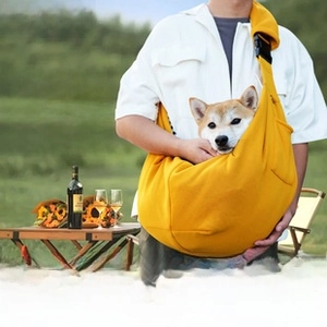 Outdoor picnic scene showing pet crossbody sling bag with adjustable padded shoulder strap
