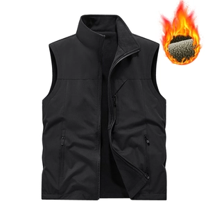 Men's reversible black fleece vest with zip pockets and thick grey thermal lining