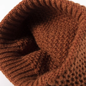 Chic tan pointed knit beanie for women showing thick woven texture and cozy warmth