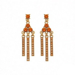 Elegant gold-tone fringe earrings featuring orange rhinestones on a white background