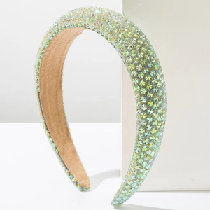 Detail of light green sponge headband with sparkling star-shaped rhinestones inlay