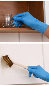 Detailed view of blue disposable nitrile gloves used for cleaning and handling glassware