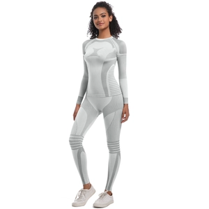 Seamless white and grey knit yoga set featuring high-waist leggings and long sleeve top