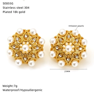 Detail of 18k gold plated stainless steel floral earrings with pearls and crystals