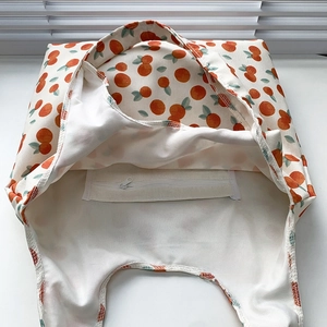 Detail view of floral tote bag interior featuring zipper pocket and double fabric lining