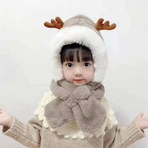 Winter plush earflap hat for kids featuring cute deer antlers in brown and beige