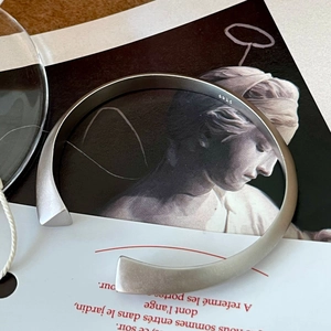 Minimalist S925 sterling silver open bangle with matte finish and twisted design