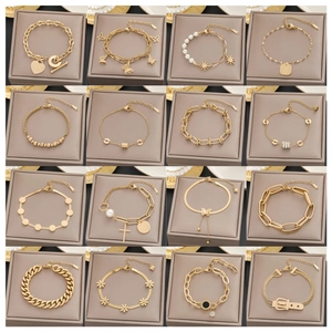 Collection of minimalist 18k gold-plated bracelets featuring diverse charms and elegant links