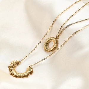 Double-layered 18K gold plated stainless steel necklace with sun and moon pendants