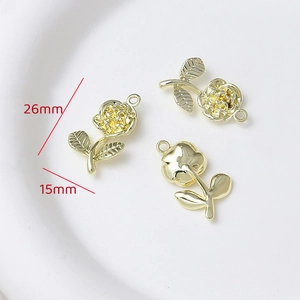 Detailed view of gold rose flower charms with 26mm by 15mm size dimensions