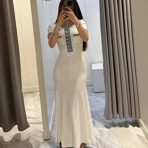Slim fit ivory knit maxi dress featuring blue denim trim and gold buttons for women