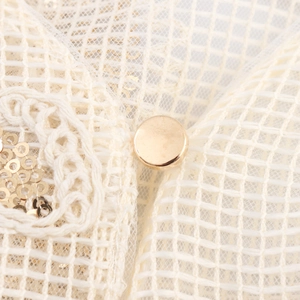 Elegant white mesh long sleeve two-piece set with gold sequins and metallic button details