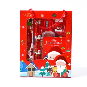 Christmas stationery gift set featuring Santa pencils and notebook in a red festive box