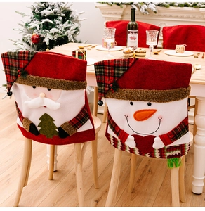 Detail of Christmas chair covers featuring Santa and Snowman figures for festive decor