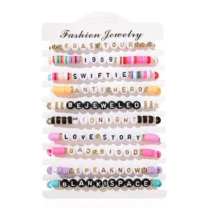 Detail of 10-piece colorful clay bead bracelet set with Taylor Swift music tour lettering