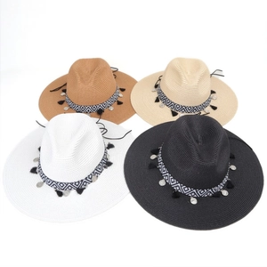Bohemian wide-brim straw hats in four colors with geometric bands and tassels