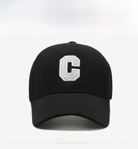 Detail of breathable black mesh baseball cap with white 3D embroidered C letter