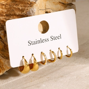 Three pairs of gold stainless steel hoop earrings with zircon on natural stone base