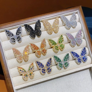 Exquisite copper open rings with colorful butterfly zircons in a beige jewelry display box