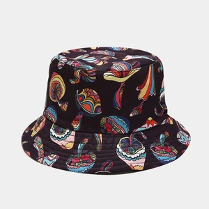 Close-up of colorful mushroom pattern print and woven texture on a black bucket hat